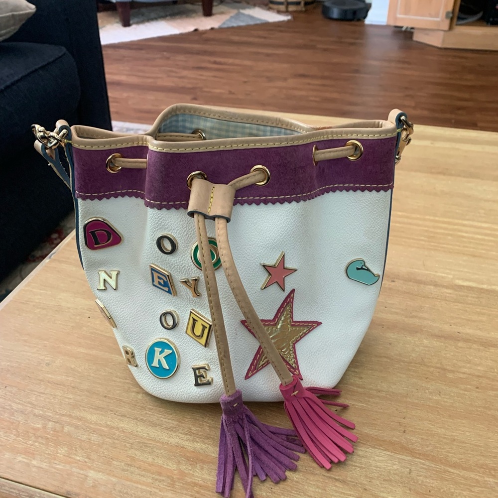 Dooney & Bourke White Bucket Bag with Purple Trim and Pink Tassels